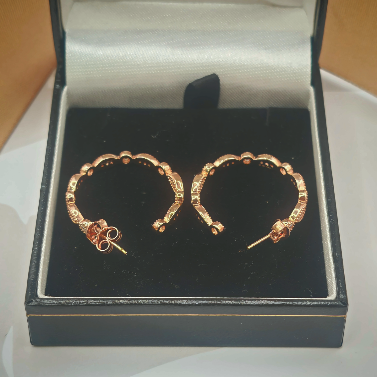 Sterling Silver Rose Gold Tone CZ Hoop Earrings, photograph 1 of 6. SKU SIL-23.