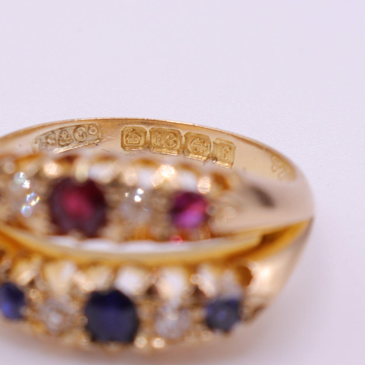 18ct Yellow Gold Ruby, Sapphire and Diamond Crossover Ring
