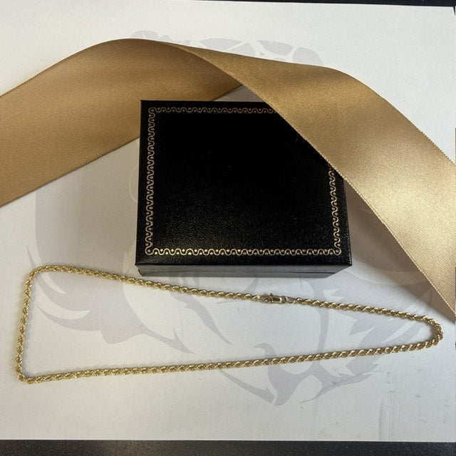 Black box with gold chain on a white background