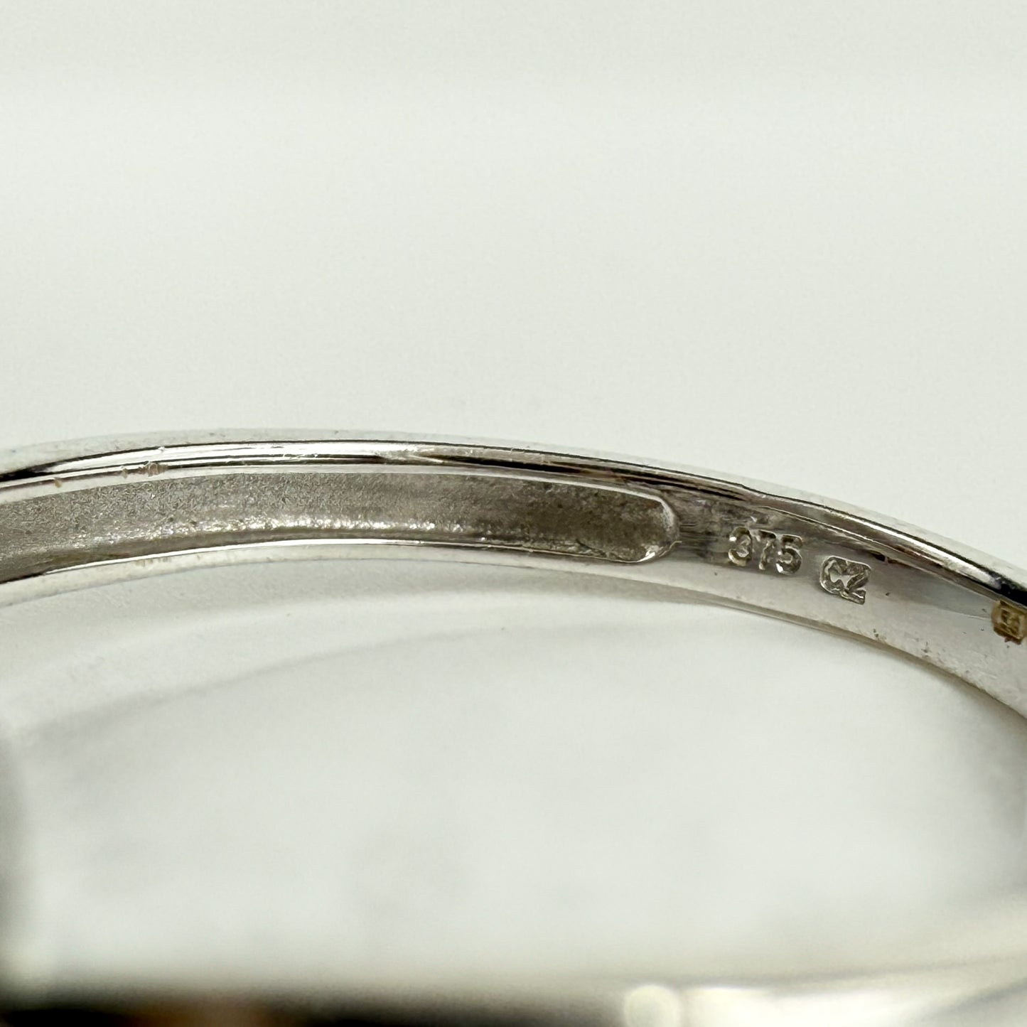 9ct White Gold Cubic Zirconia Three-Stone Ring with Channel Set Shoulders