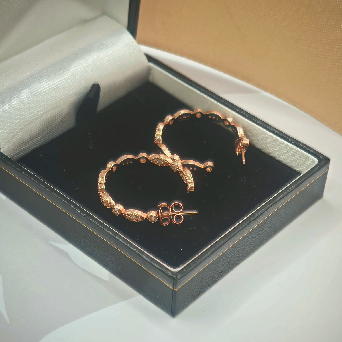 Sterling Silver Rose Gold Tone CZ Hoop Earrings, photograph 2 of 6. SKU SIL-23.