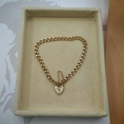 9ct Yellow Gold Curb Link Bracelet with Heart Padlock Clasp, photograph 1 of 8. SKU JB3627.
