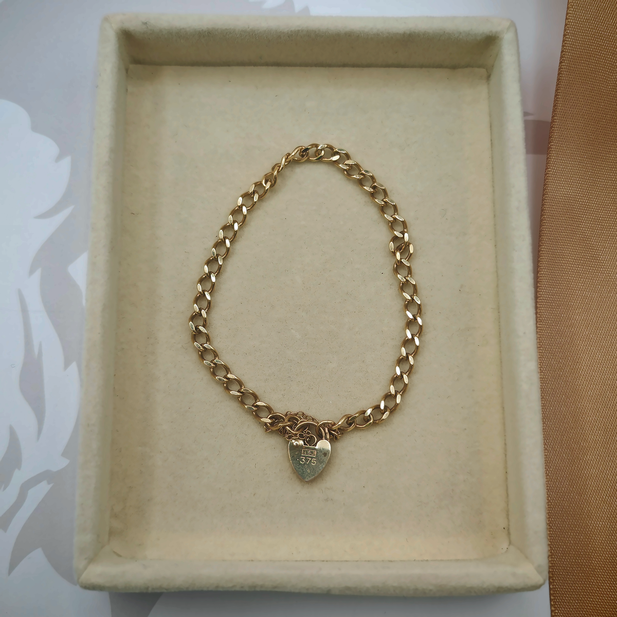 9ct Yellow Gold Curb Link Bracelet with Heart Padlock Clasp, photograph 2 of 8. SKU JB3627.