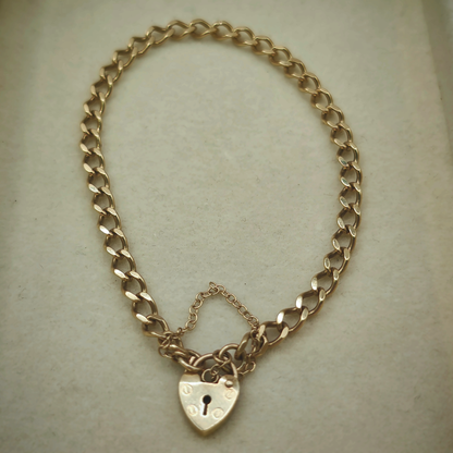 9ct Yellow Gold Curb Link Bracelet with Heart Padlock Clasp, photograph 3 of 8. SKU JB3627.