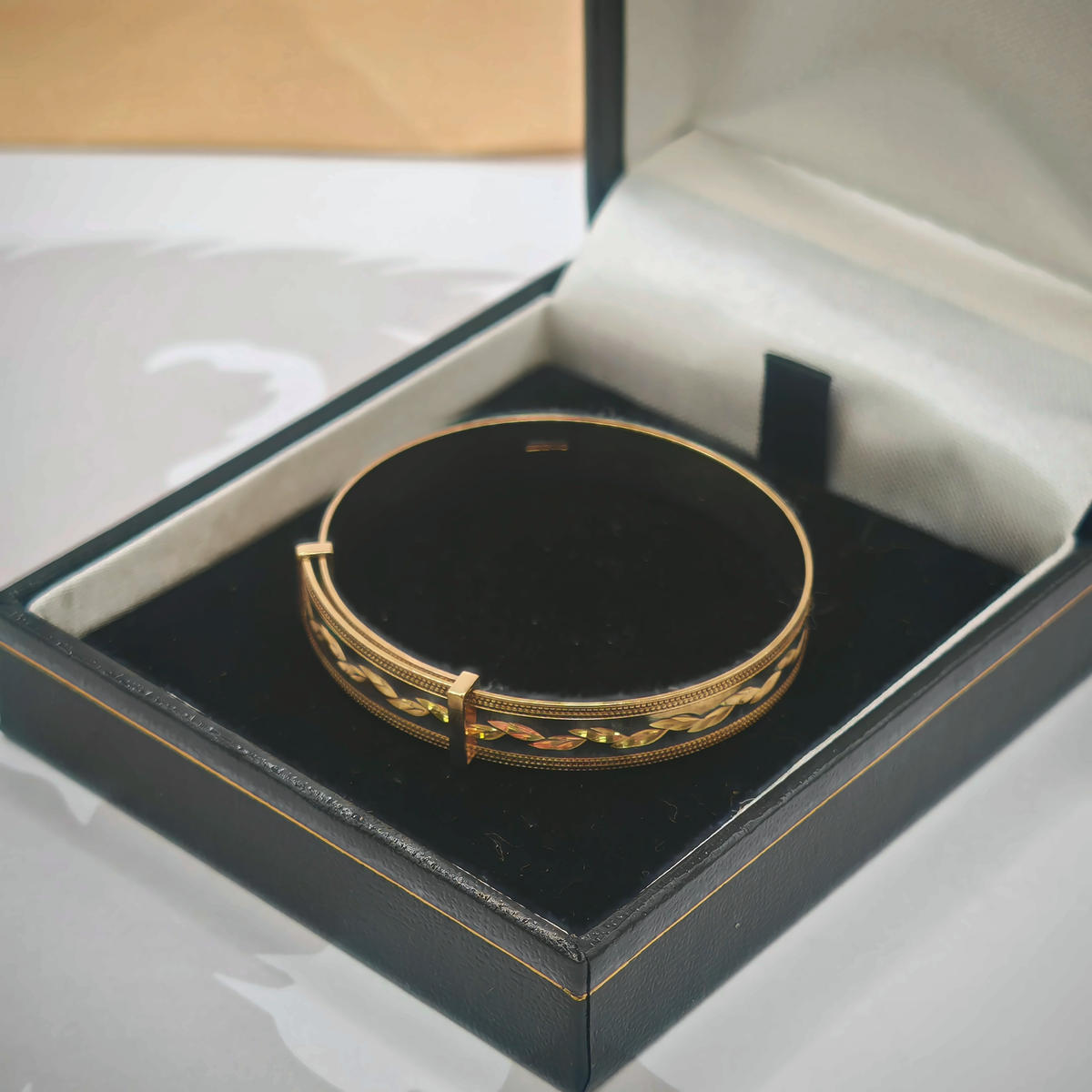 9ct Yellow Gold Engraved Leaf Design Hinged Bangle, photograph 3 of 7. SKU JB3628.