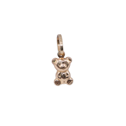 Gold teddy bear pendant on a light gray background