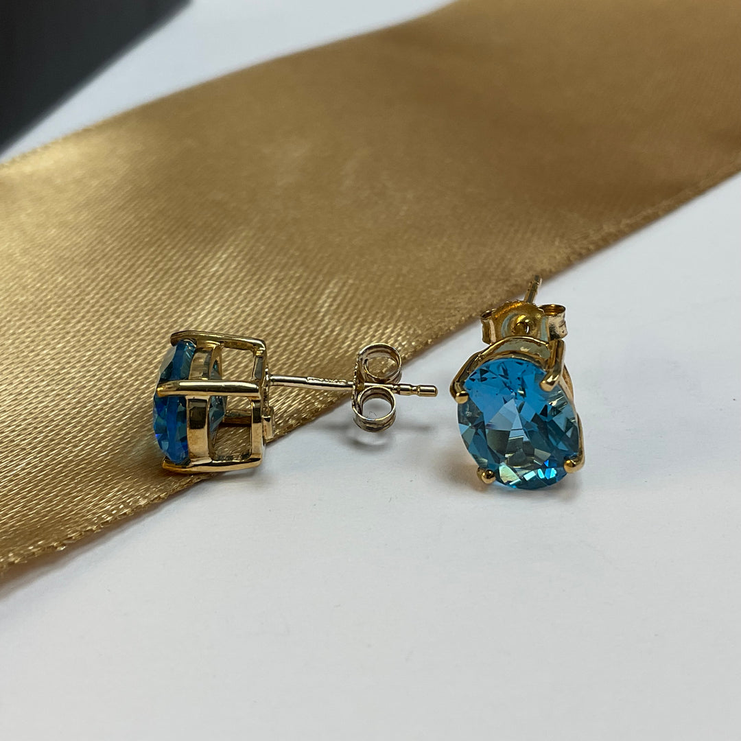 9ct Yellow Gold Blue Topaz Oval Stud Earrings