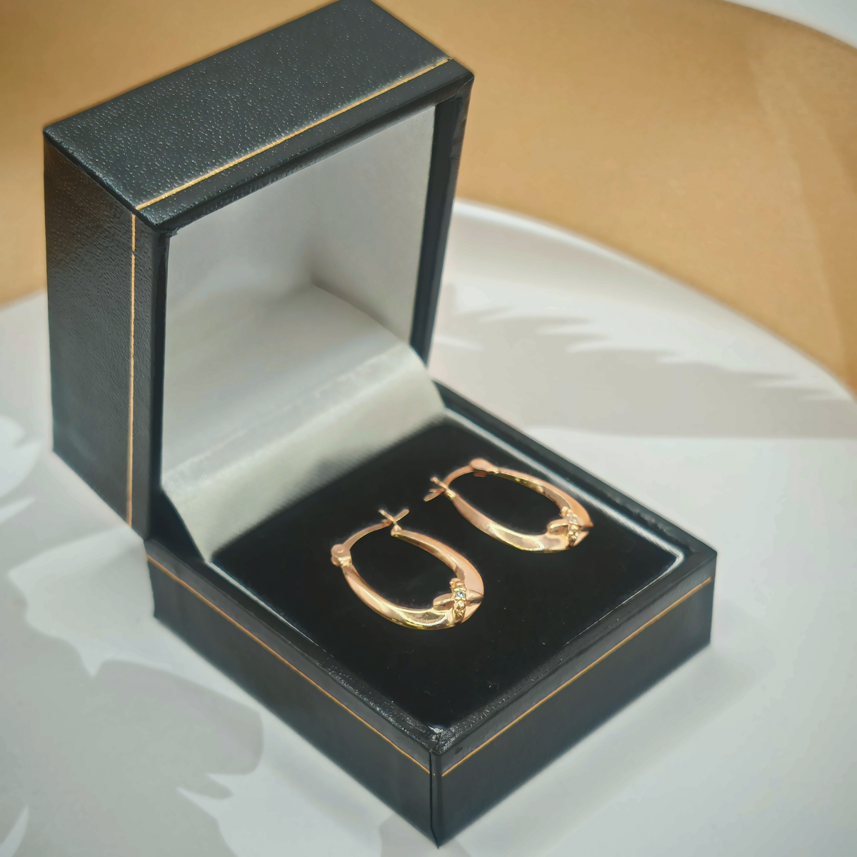 Yellow Gold Tone CZ Bow Detail Oval Creole Hoop Earrings – view 2